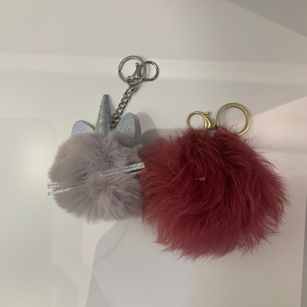 two pom pom key chains silver and gold keychains